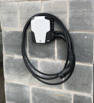 Front view of Senec Wallbox Pro ABL eMH1 Basic 1W2208 22kW EV Charger mounted on stone wall